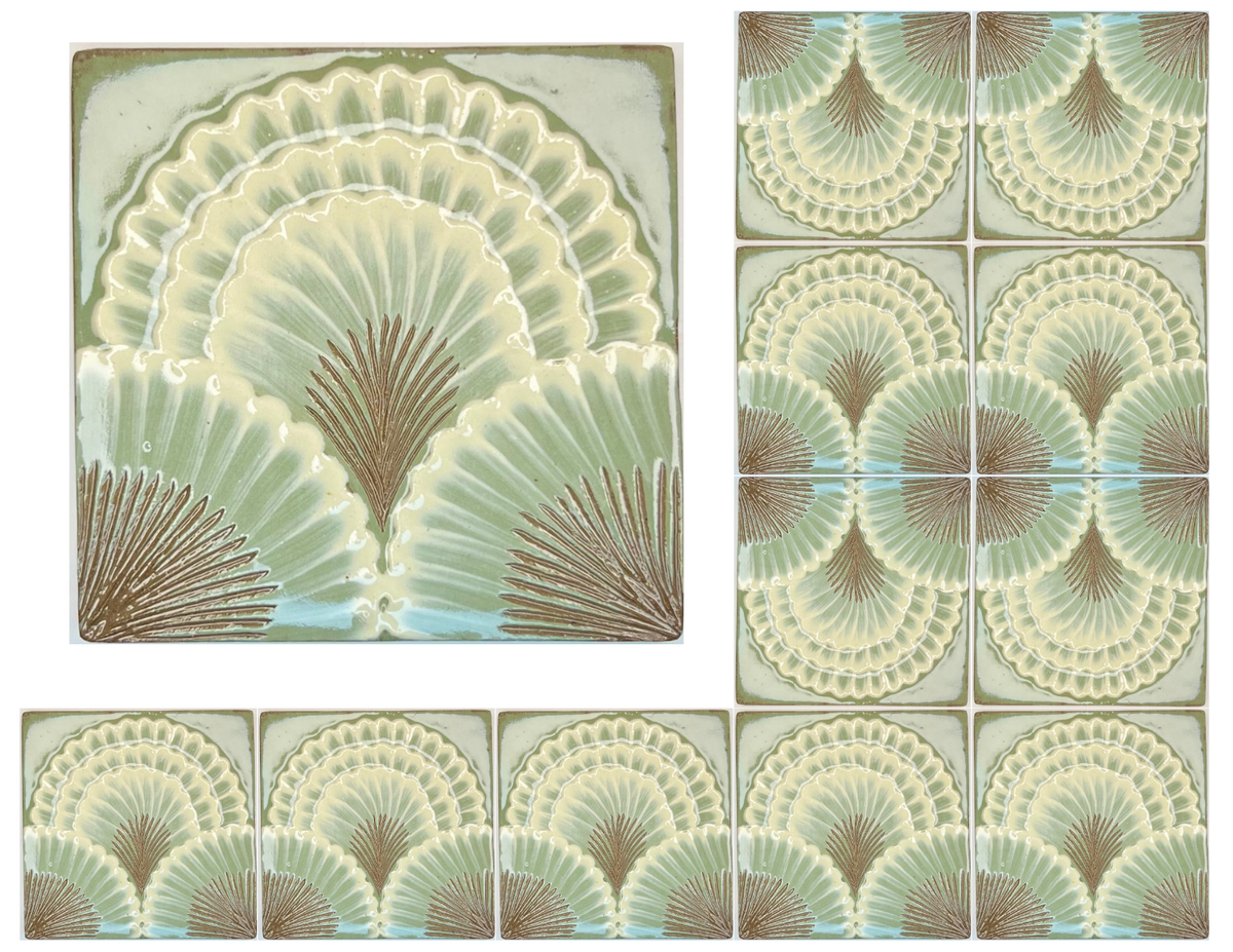 Decorative ceramic tiles featuring a repeating Art Deco fan or scallop pattern in pale green, cream, taupe, and light blue on a warm gray background.